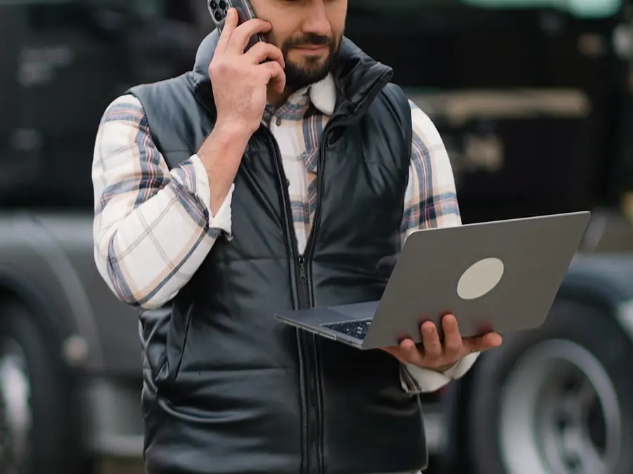 Dispatcher on the phone beside a truck