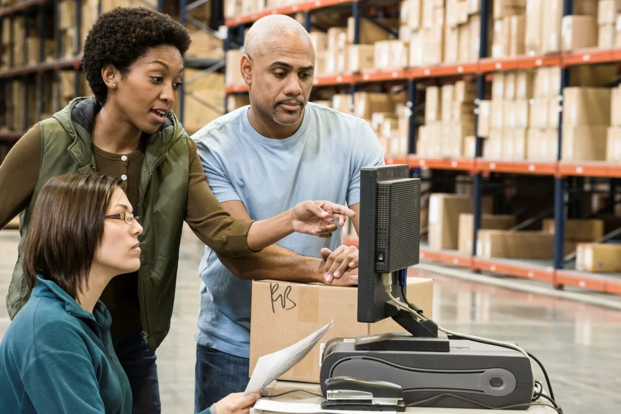 Warehouse team checking stock and orders